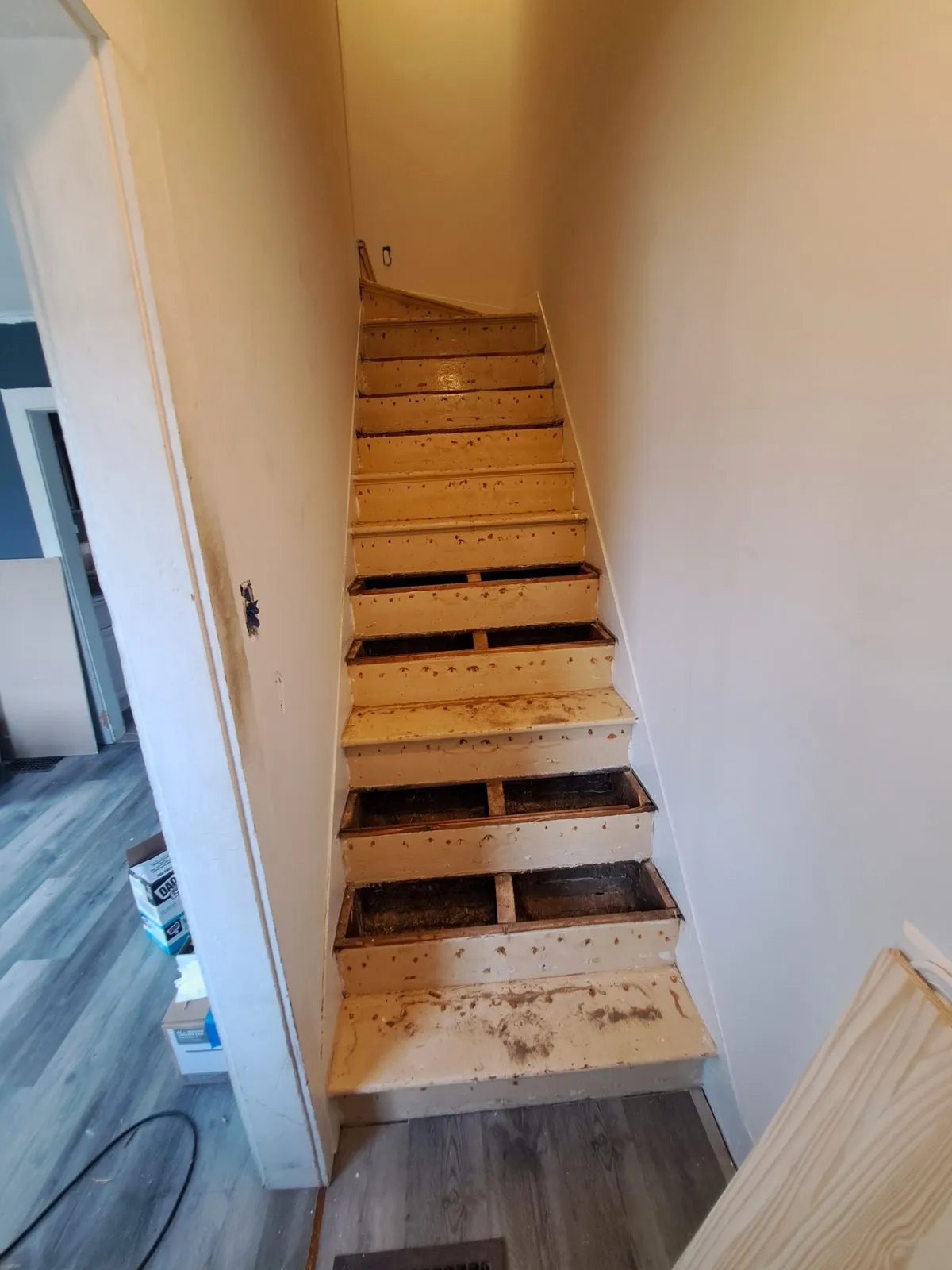 Before — stairwell carpentry during a Sutton, MA remodel