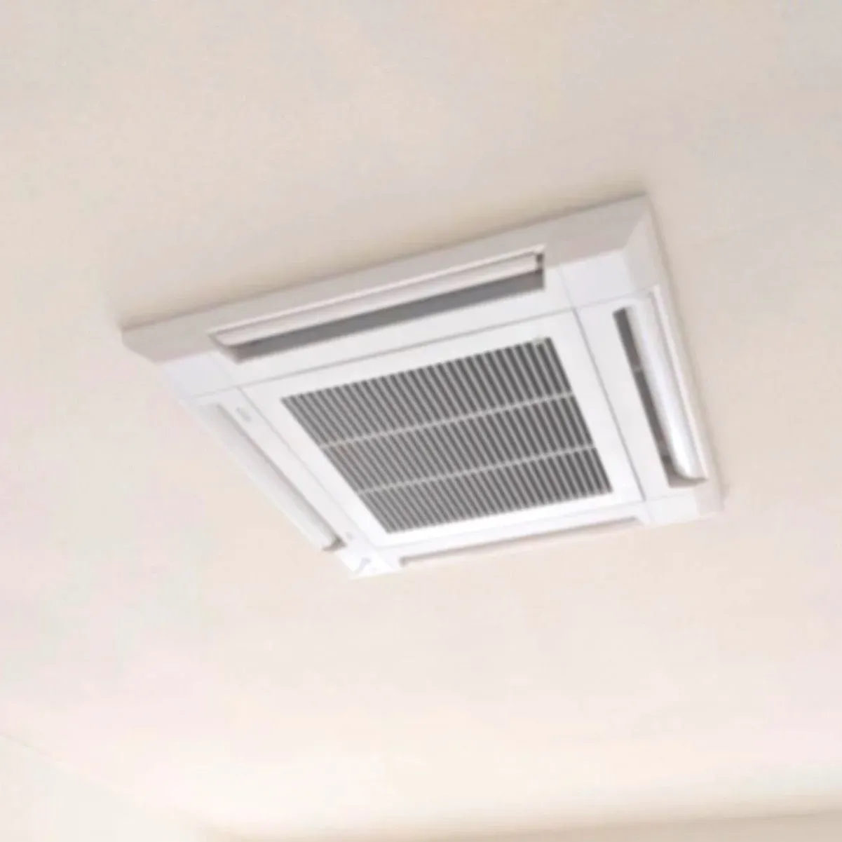Ceiling-mounted air conditioning unit with vents
