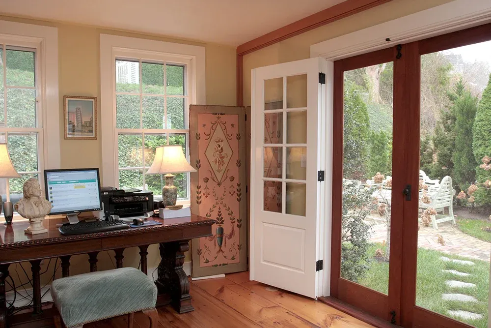 Home office with restored French doors and trim