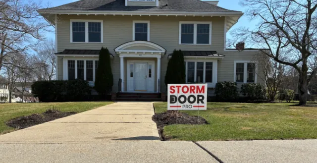 Greater Boston home with a Storm Door Pro yard sign out front