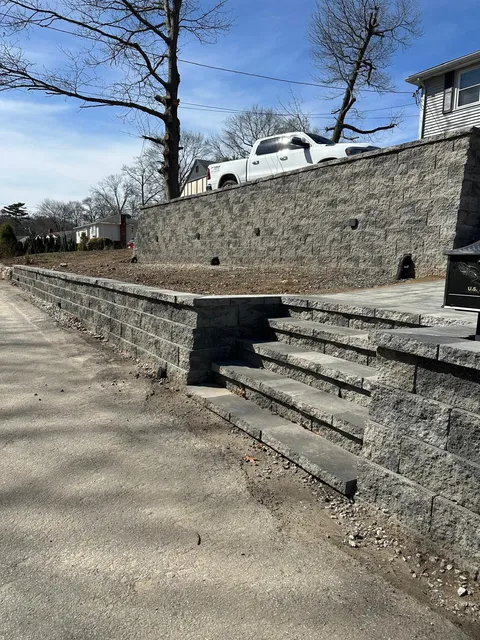 Granite block retaining wall with steps built in Boston, MA