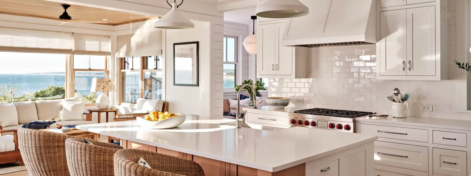 Large windows flood a modern kitchen with light and offer ocean views – McPhee Associates of Cape Cod.
