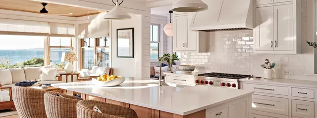 Large windows flood a modern kitchen with light and offer ocean views – McPhee Associates of Cape Cod.
