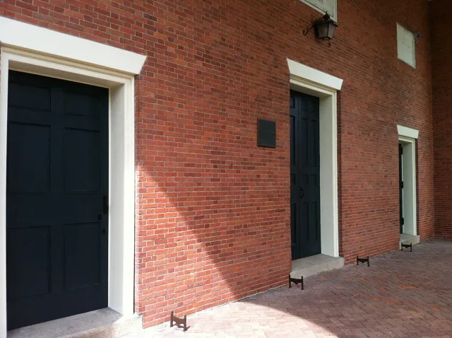 Restored brick facade with new doors and trim