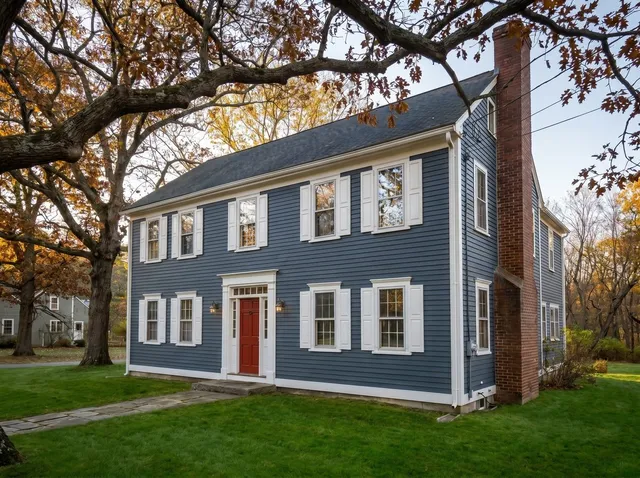 Restored colonial home with fresh Hale Navy paint and white trim — after Overwall Painting exterior project