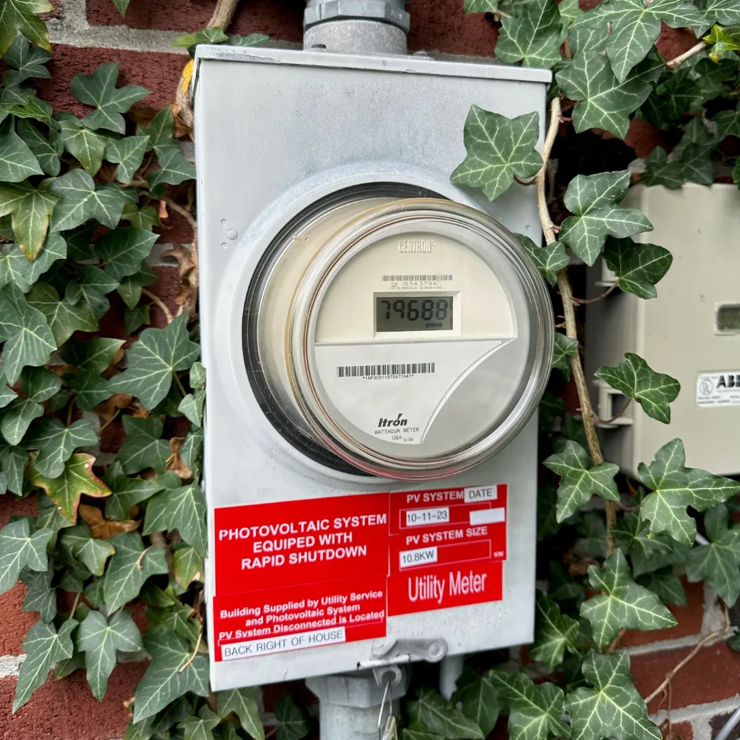 A NH home's utility meter tagged with a 10.8kW solar system — one less electric bill thanks to Granite State Solar