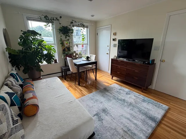 Great location!! Can walk to Harvard, Inman & Central squares and Kendall sq. home of MIT is a bus stop away using MBTA bus 68.It is across from Beautiful Joan Lorentz Park and the Cambridge Public Library. It is a corner top floor unit that has lots of windows and gets great light.Bathroom and kitchen have been updated. Hd floors throughout. Lndry and a private storage room in basement. Store bikes. Heat and hot water are included in condo fee. Great investment condo or first time buyer condo. O.H. Saturday 8/15/26 11:00-12:30 P.M.