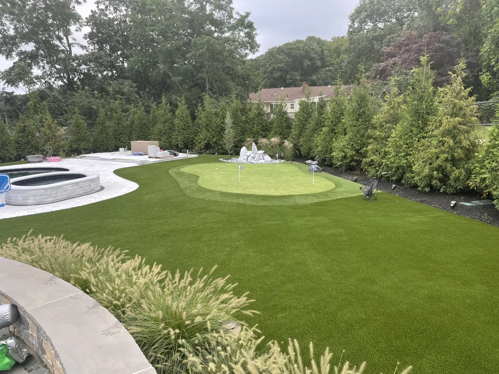 backyard putting green artificail turf around pool boston