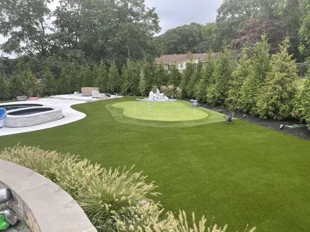 backyard putting green artificail turf around pool boston