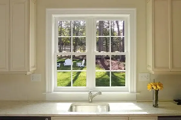 double hung windows above a sink in a kitchen