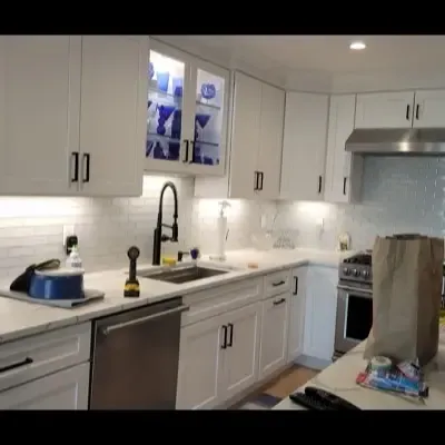 Full kitchen renovation with quartz countertops and subway tile backsplash