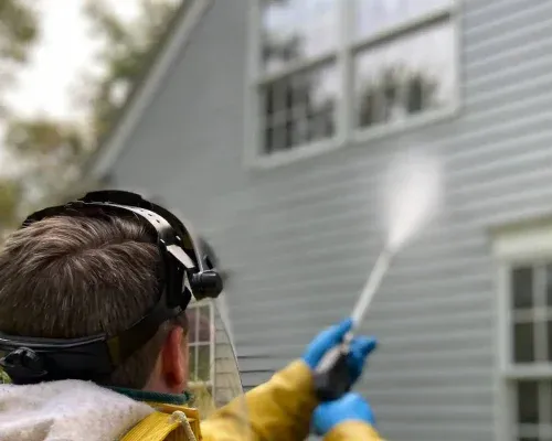 Pressure-Washing-House-Siding-before-Painting-ProTEK-Painters-Newton-MA-1200x800-1.webp