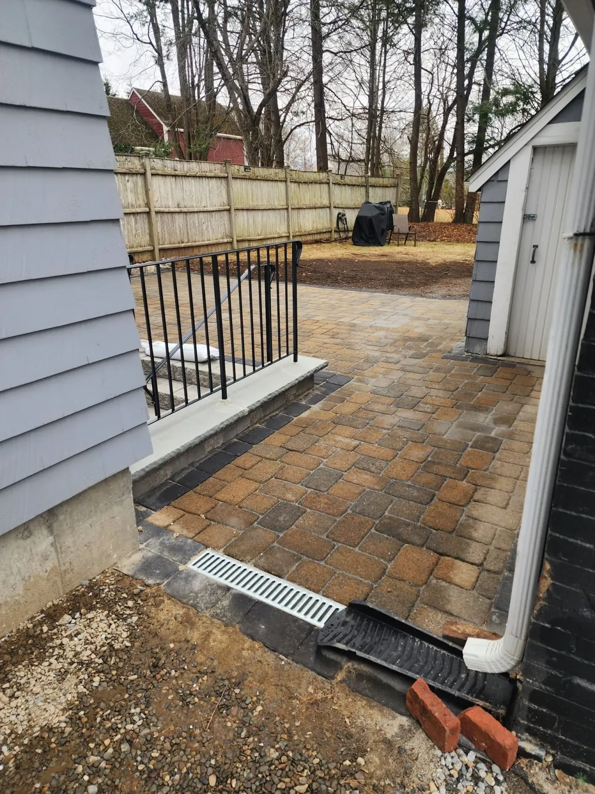 Paver patio and walkway in Lexington, MA. Granite step installation and outdoor patio project.