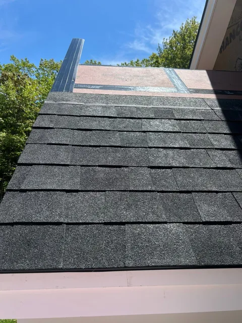 New architectural asphalt shingle roofing installed on a home
