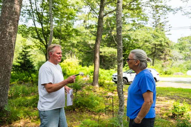 Colby & Gale Energy Advisor Shawn Leeman providing a home energy consultation and discussing heating solutions with a local customer.