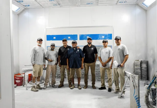 Compass Painting owner Ivan Junior and crew inside the cabinet finishing shop in Hyannis Cape Cod