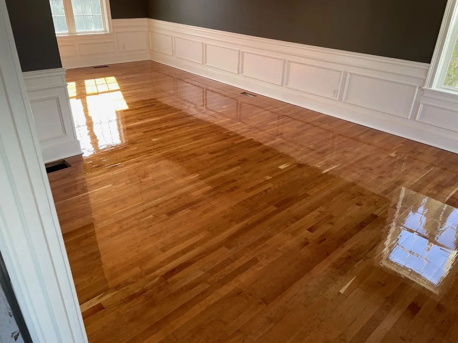 Newly installed maple hardwood floors in Westborough Massachusetts dining room.