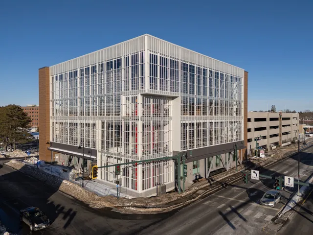 Aerial view of a modern multi-story commercial building with glass facade.