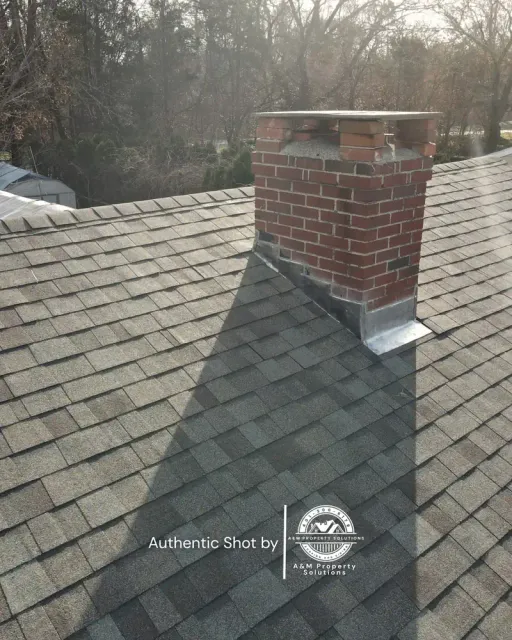 Finished roof with rebuilt chimney flashing detail on a Johnston, RI home.