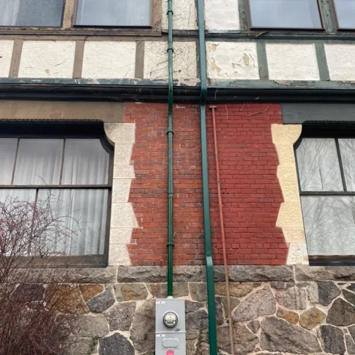 Meter and riser installation on a masonry home