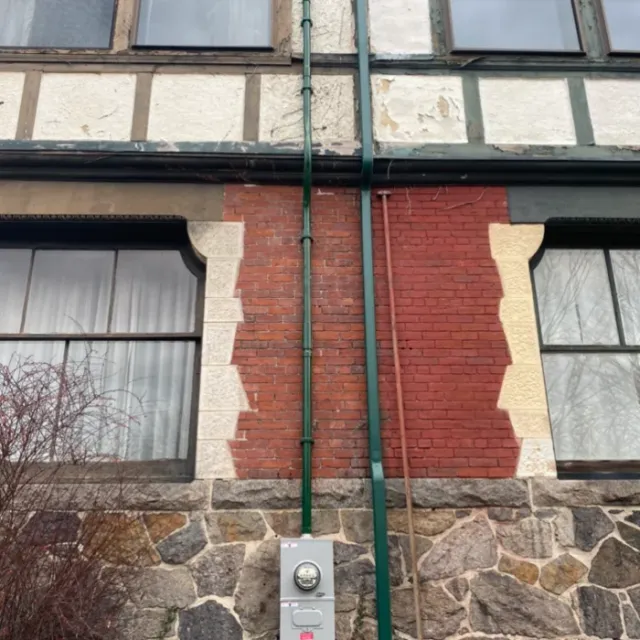 Meter and riser installation on a masonry home