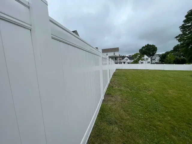 White vinyl privacy fence installation by The Right Fence