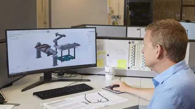 engineer reviewing fabricated metal part CAD drawings