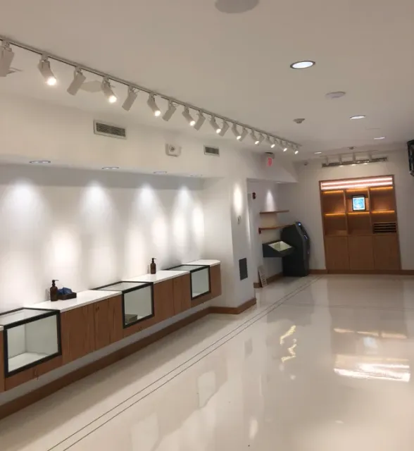 A large room with a lot of lights on the ceiling