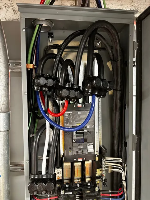 A Complex Electrical Panel with Multiple Colored Cables and Connections