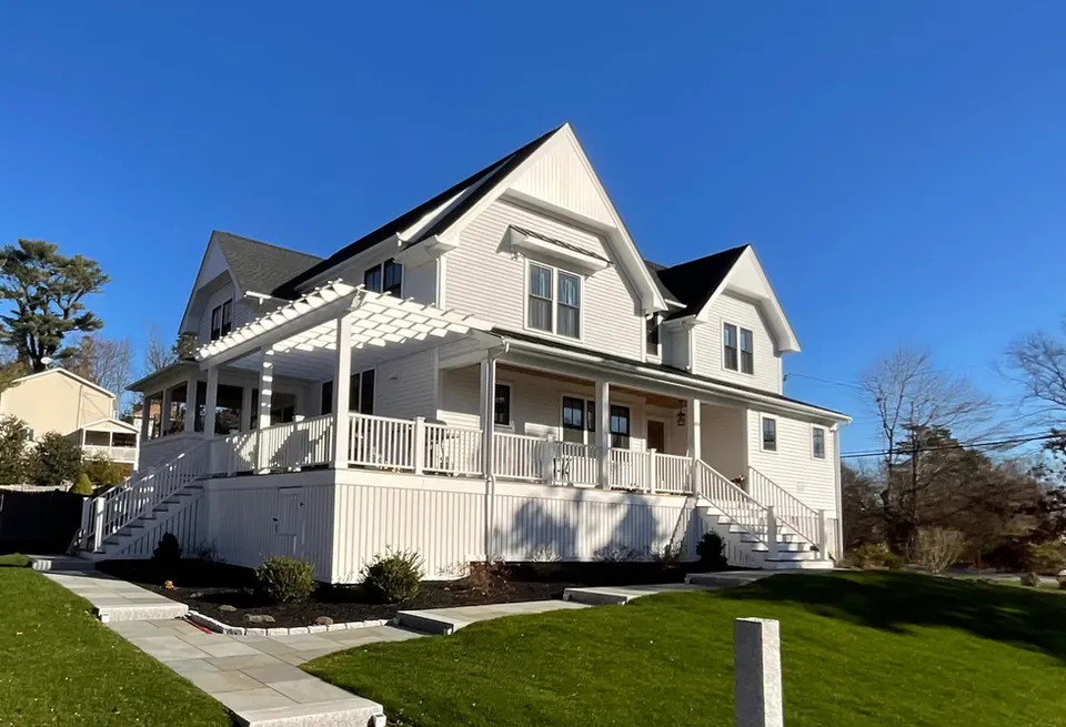 Completed home with new porch in Marshfield, MA by Luxus Construction