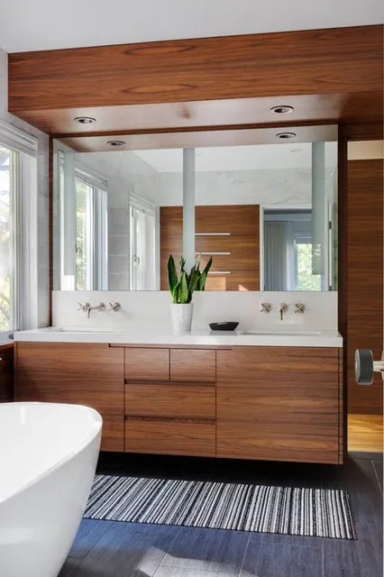 Custom bathroom vanity with dual sinks and wood panels