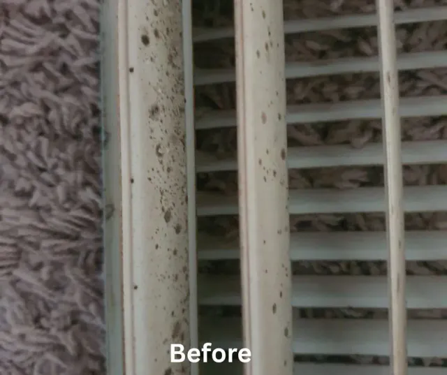 Close-up of a residential vent covered with dust before Clean Air Pro air duct cleaning Massachusetts service.