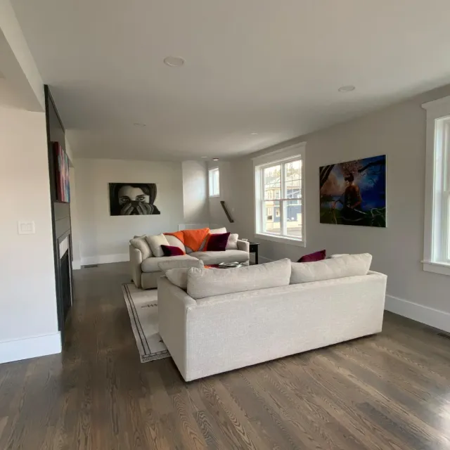 Finished living room with hardwood floors