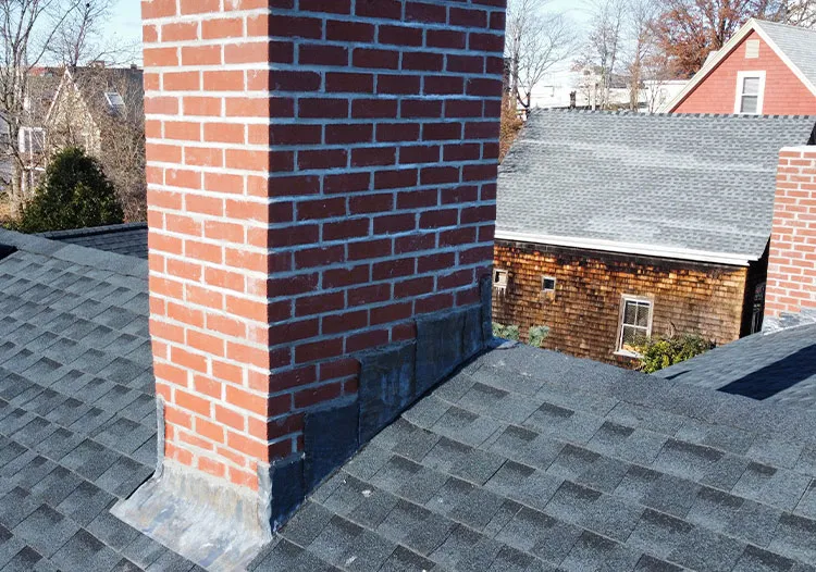 Olympic roofing perfectly done chimney flashing.