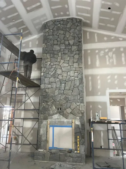 Stone fireplace surround during installation
