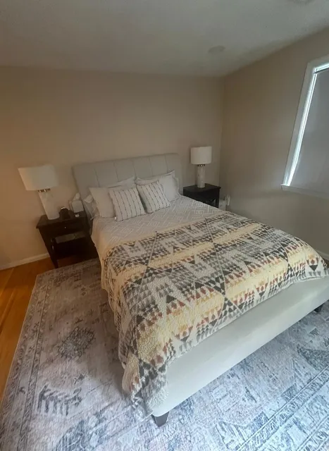 Neatly cleaned and tidy bedroom in a Metro Boston home by Allegry Cleaning Services