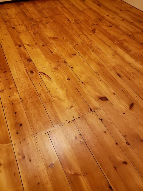 A close up of a wooden floor in a room