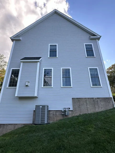 Clean white vinyl siding after soft wash house washing