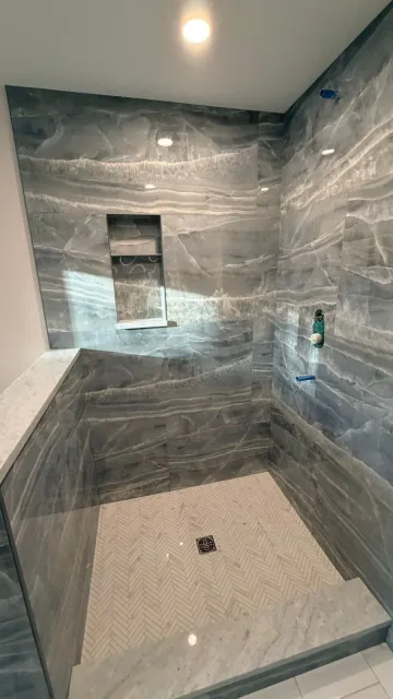 Gray marble shower tile installation by Tile of America in West Yarmouth, Cape Cod