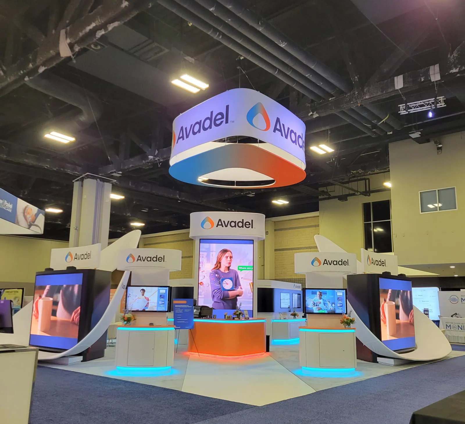 Avadel trade show booth with digital displays