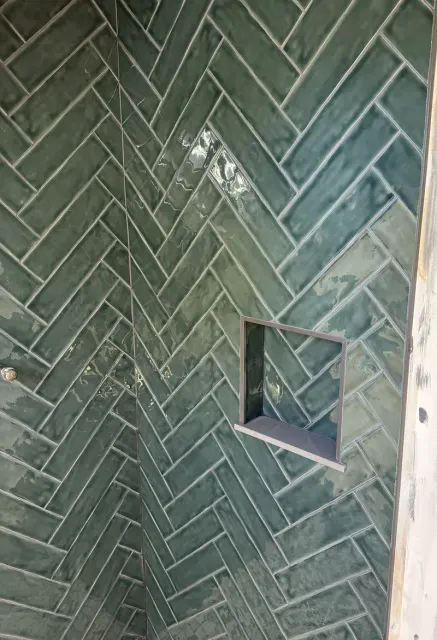 Detail of the herringbone pattern meeting a recessed niche