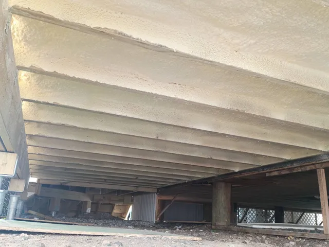 Underside spray foam insulation at a Salisbury Beach Massachusetts coastal property