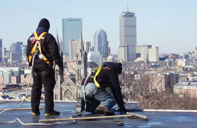 Corolla crew working on a Boston rooftop