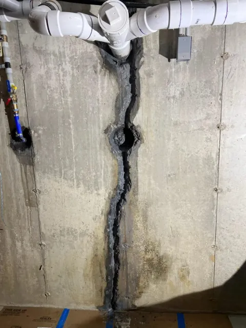 Before: foundation wall crack repair with carbon fiber grid and garage slab rebuild in Westport, CT