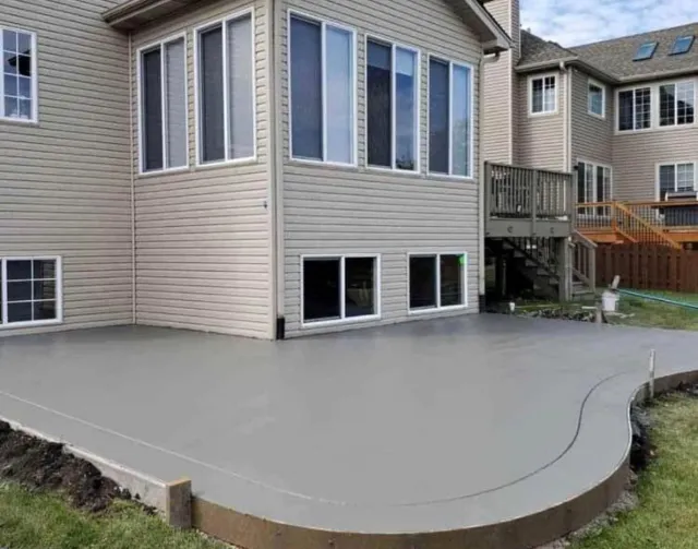 A large house with a large patio in front of it.