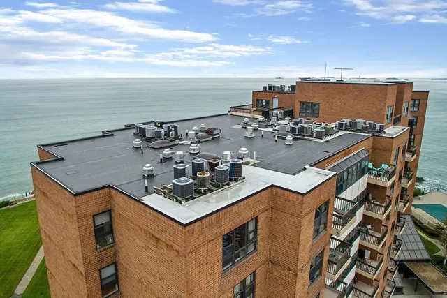 Rooftop mechanical and membrane work overlooking the harbor