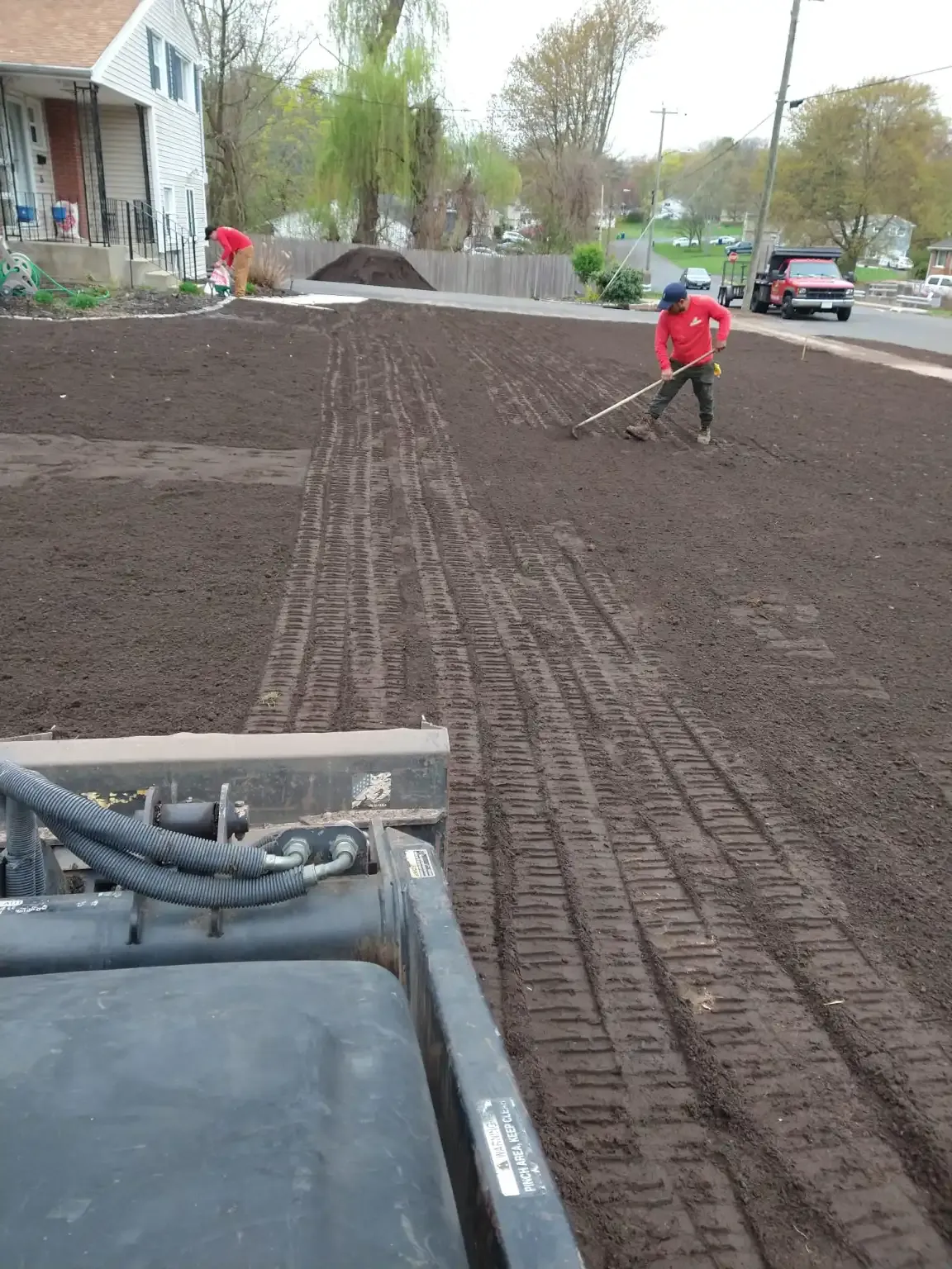 landscaper tilling a yard