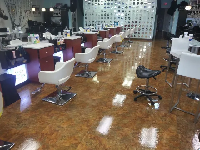 A salon with a lot of chairs and tables