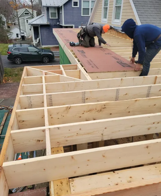 A man working on a new construction deck