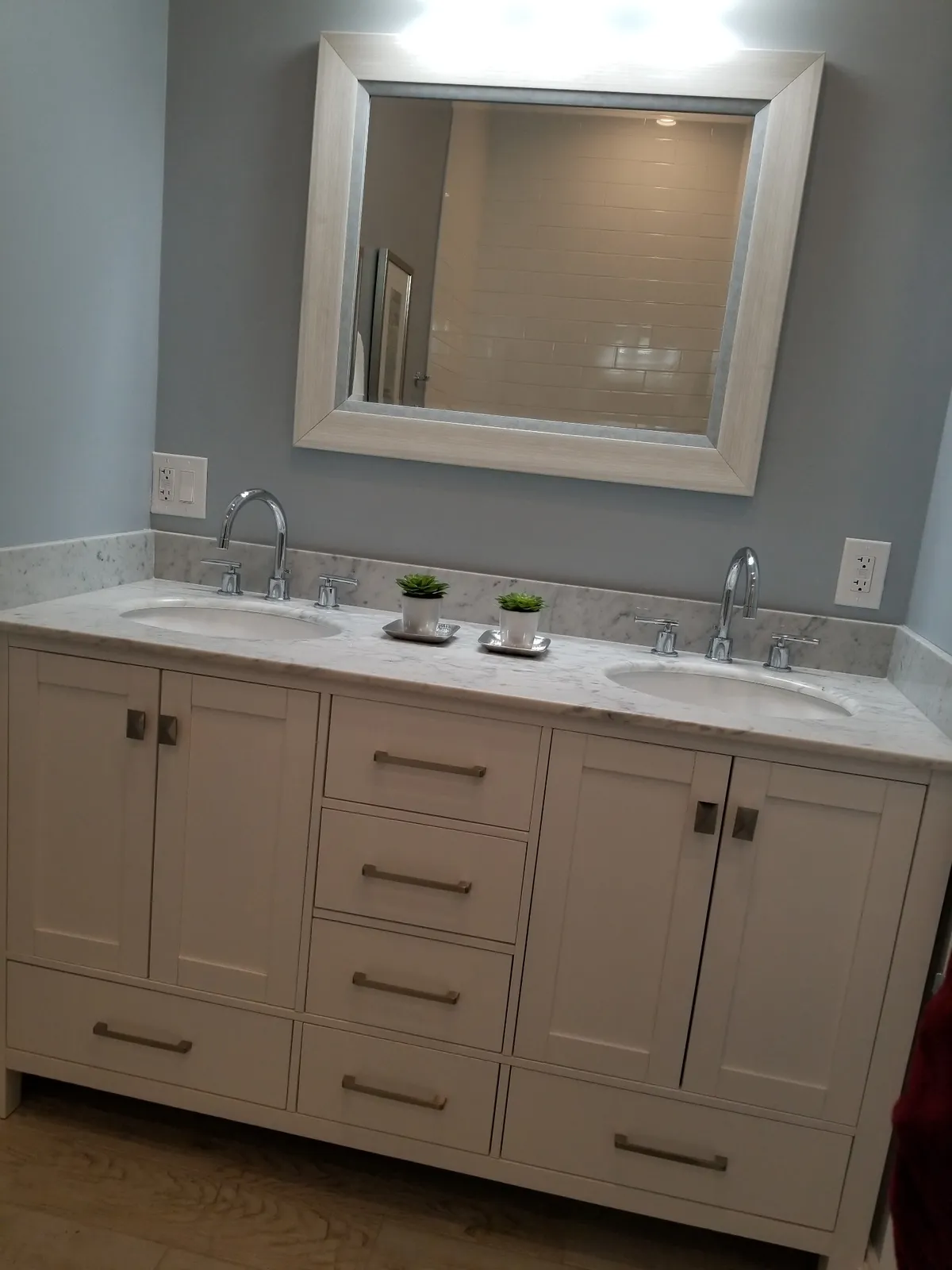 Bathroom vanity with mirror lighting and GFCI outlets